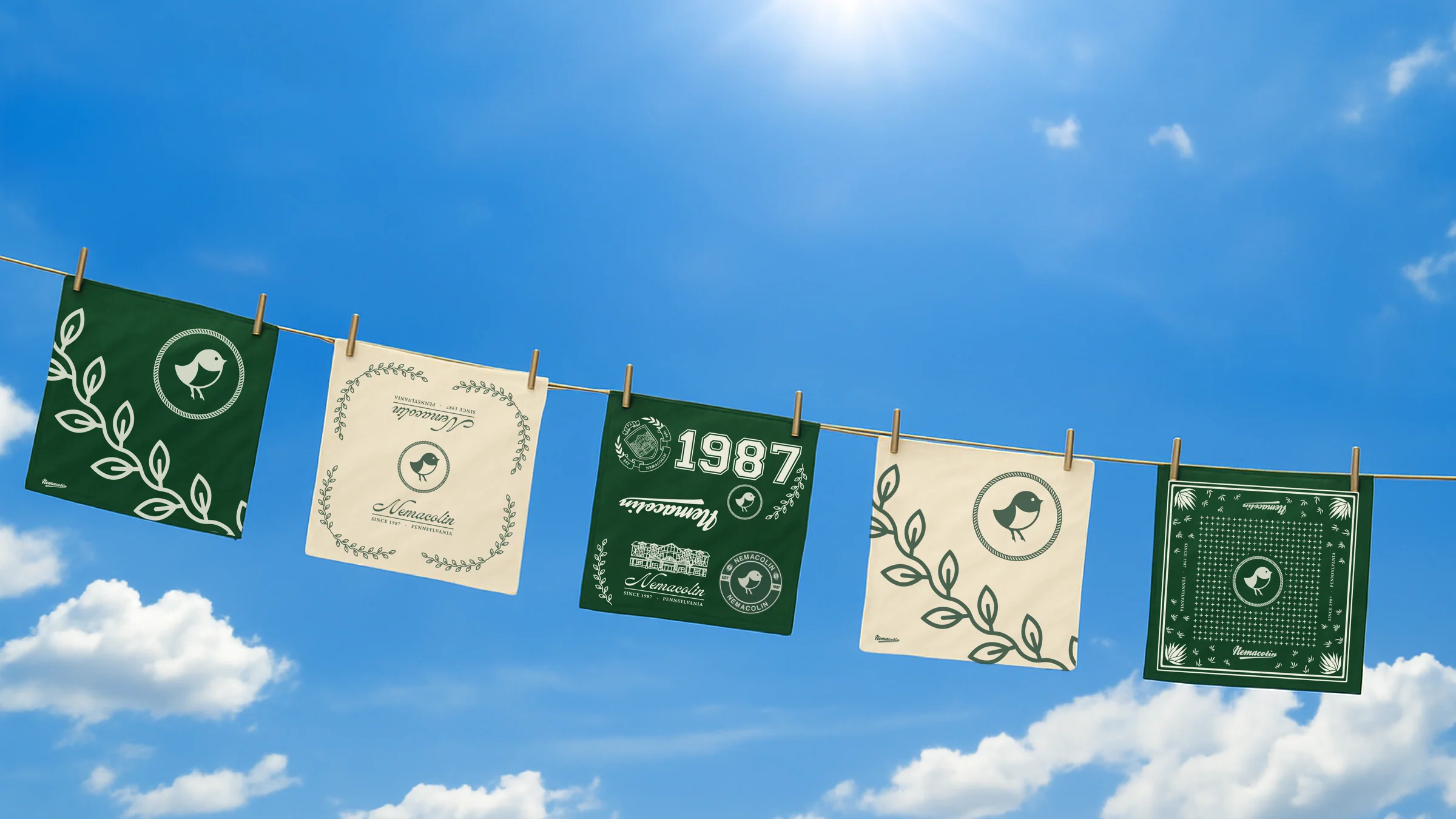 Nemacolin heritage crest flags and pennants strung against a blue sky