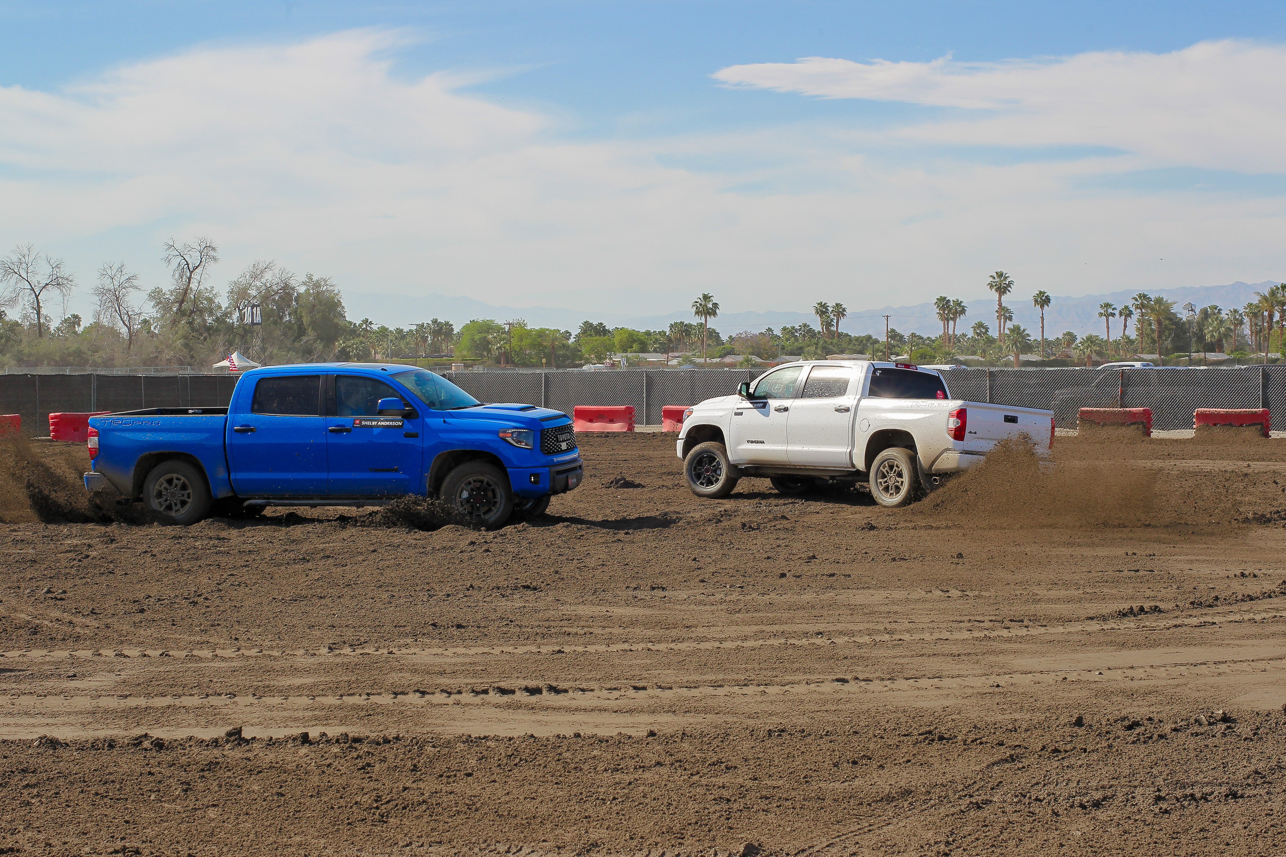 Toyota Tundras staged on the dirt course at Paradise Park