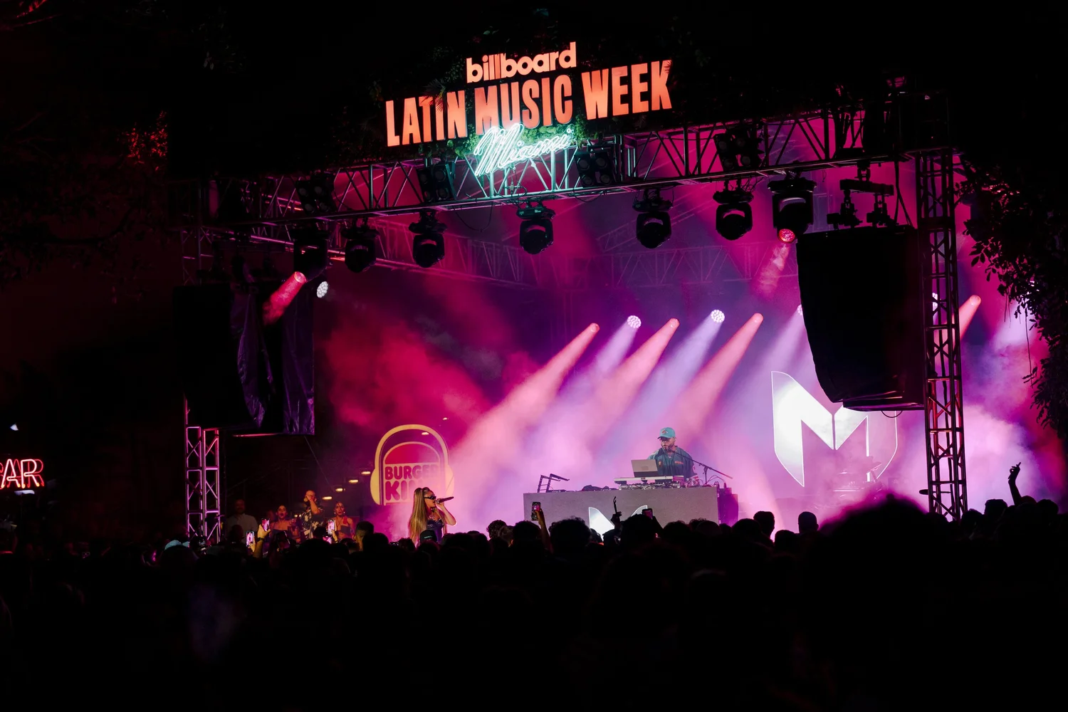 Billboard Latin Music Week main stage under saturated purple lighting with Burger King branding