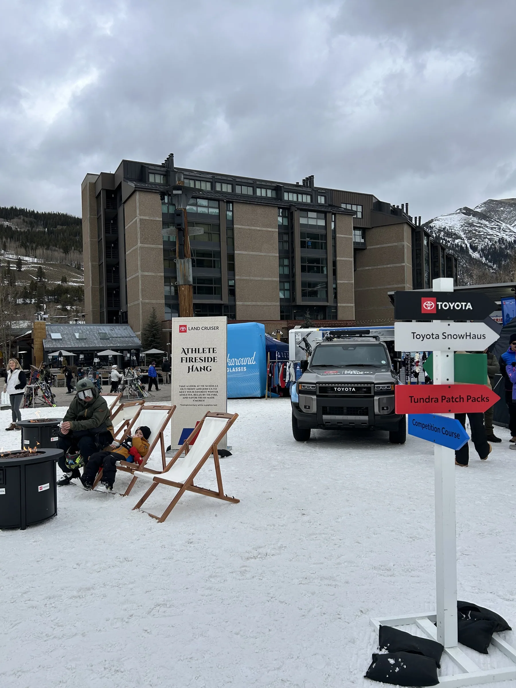 Toyota wayfinding signage and fireside hangout in the snow-covered village