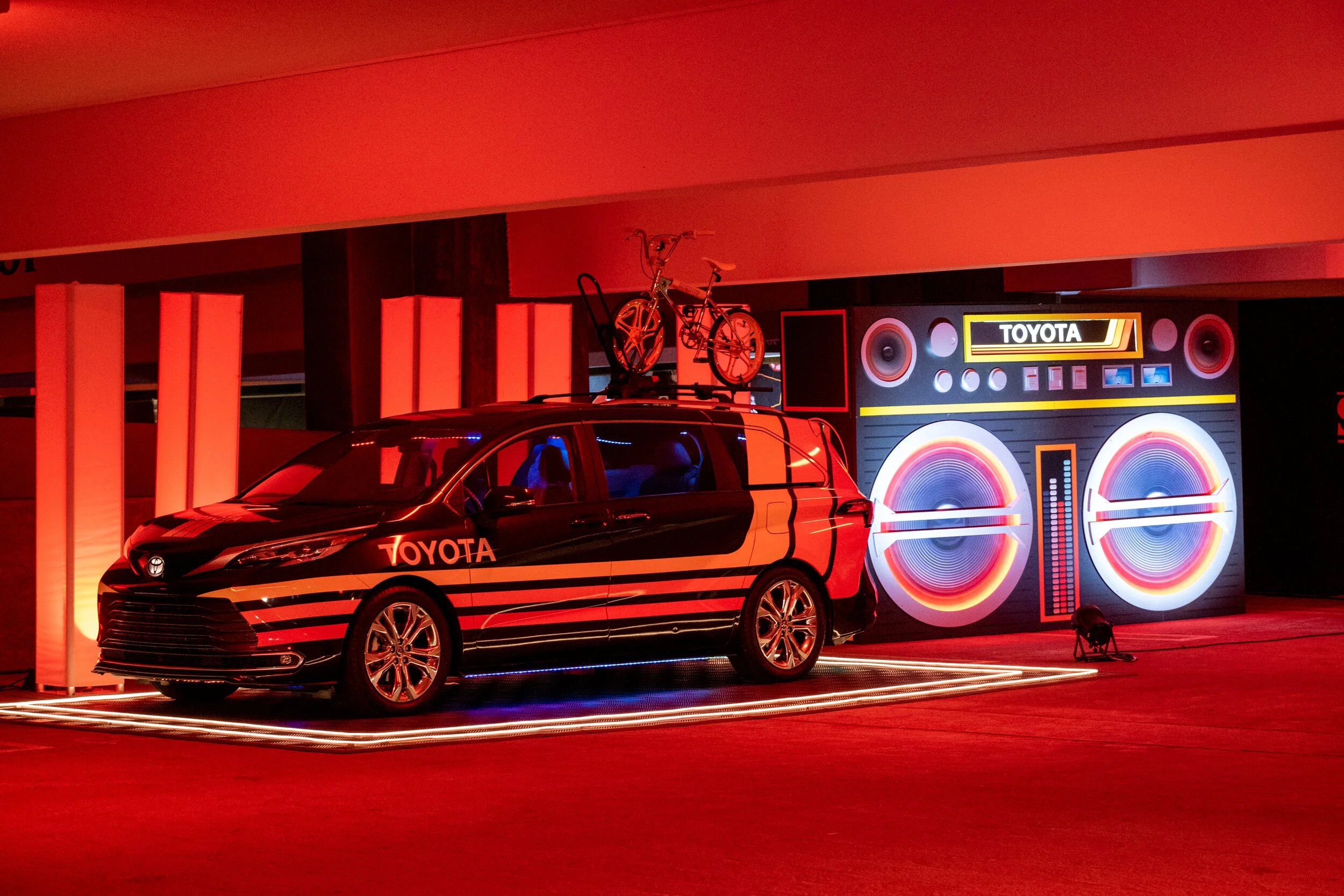 Toyota Sienna wrapped as a red vintage boombox at an outdoor activation