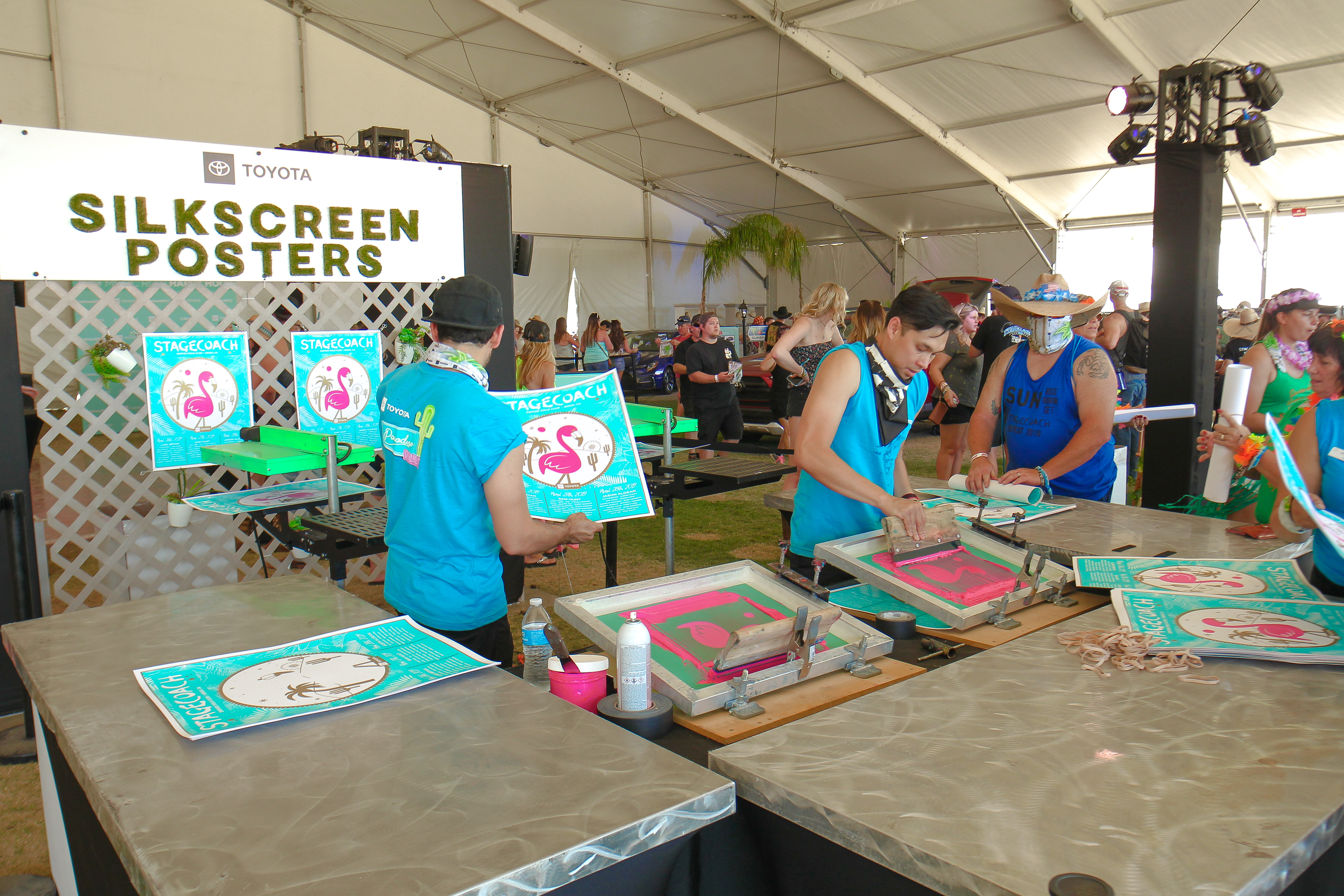 Custom silkscreened posters lined up at Paradise Park