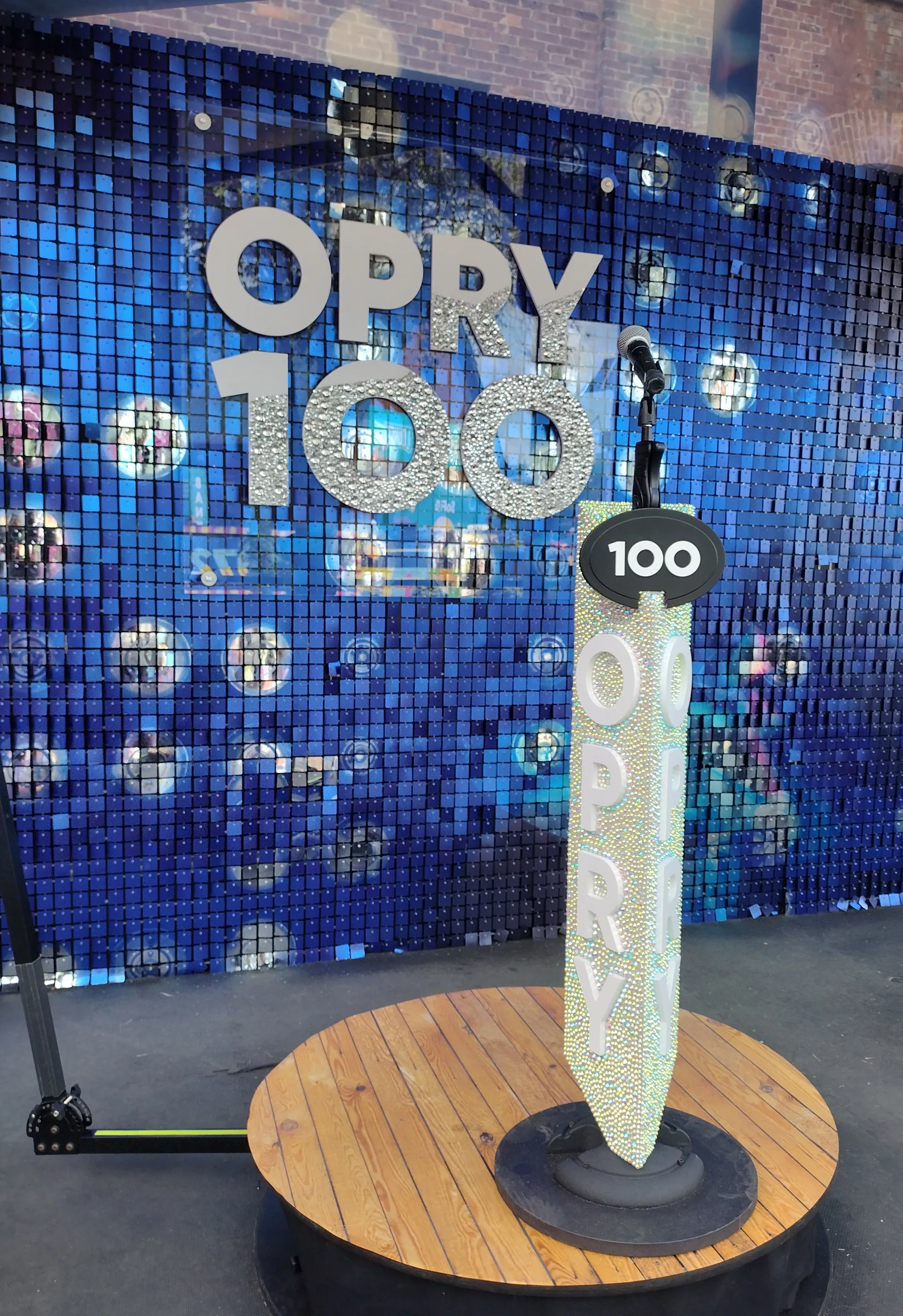 Oversized guitar floor sculpture set into the Opry 100 exhibition floor