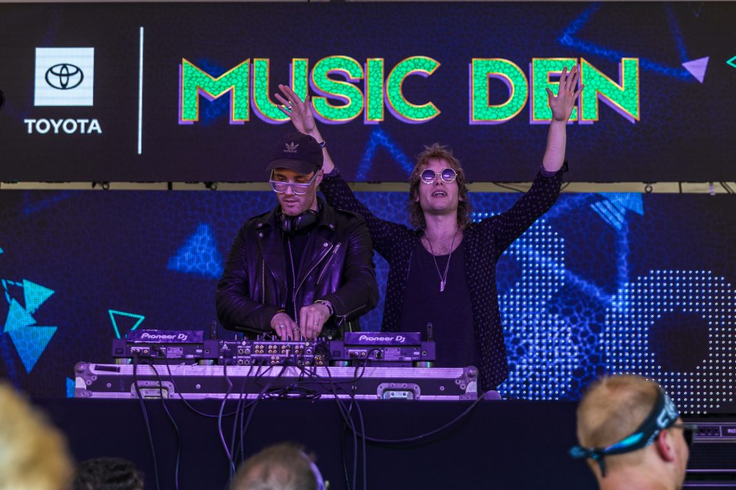 DJs performing under the Toyota Music Den LED wall