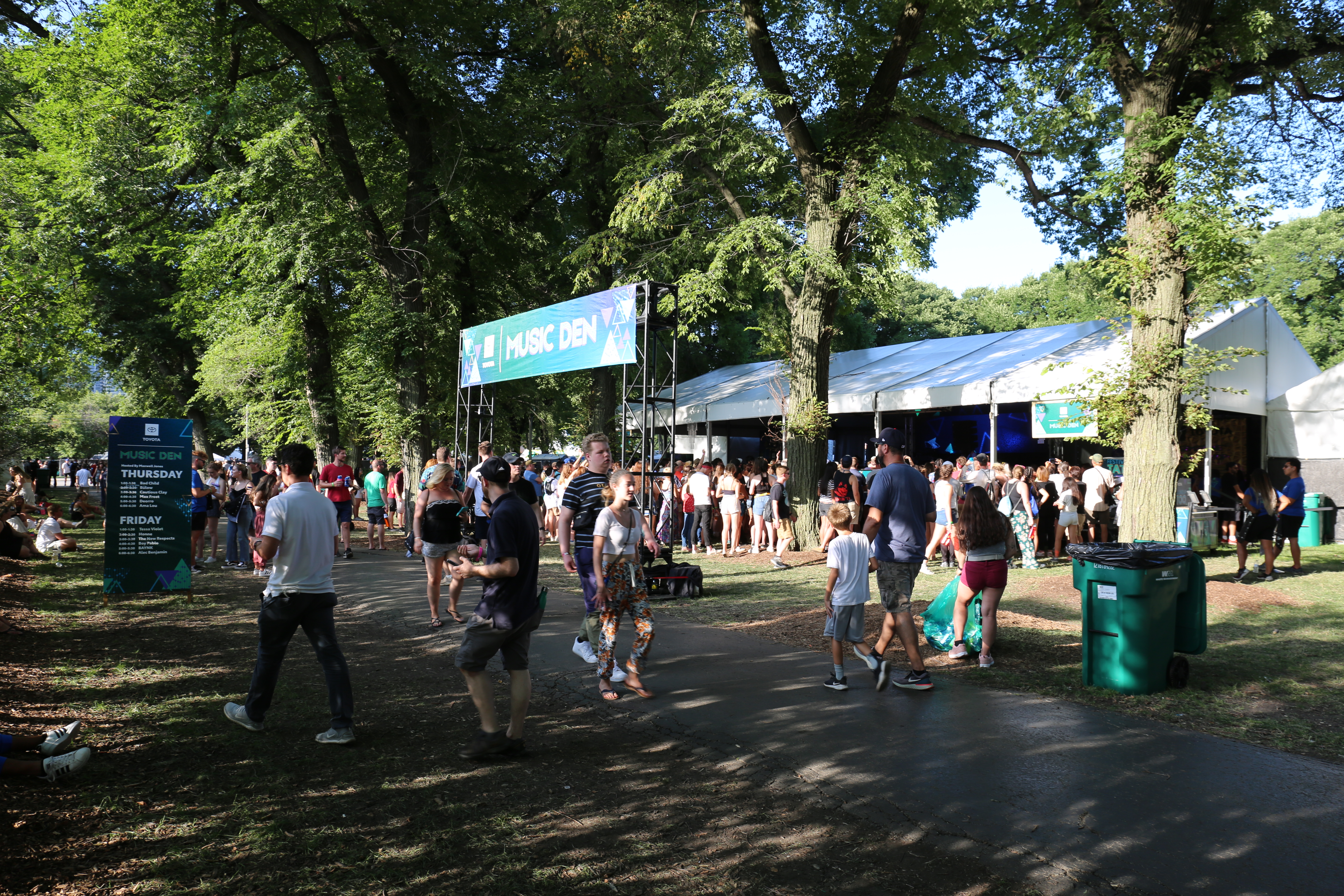 Toyota Music Den tent with the Chicago skyline behind the Lollapalooza crowd